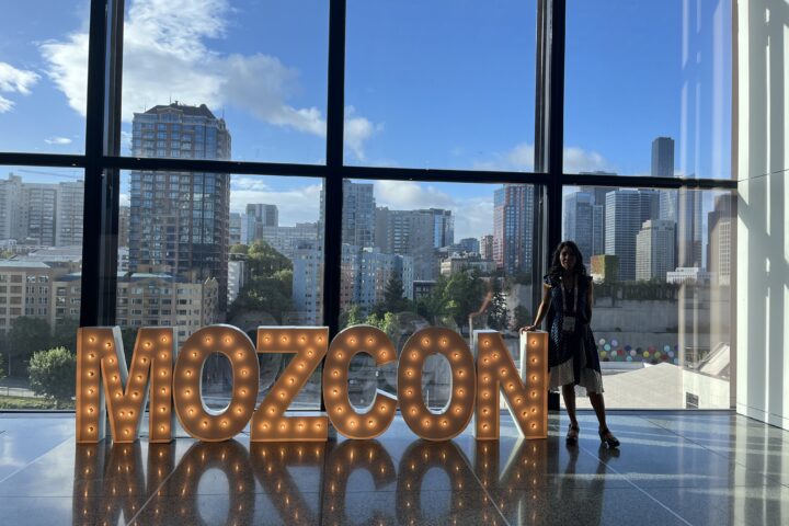 A view from the window at MozCon conference with kristine and a Mozcon sign